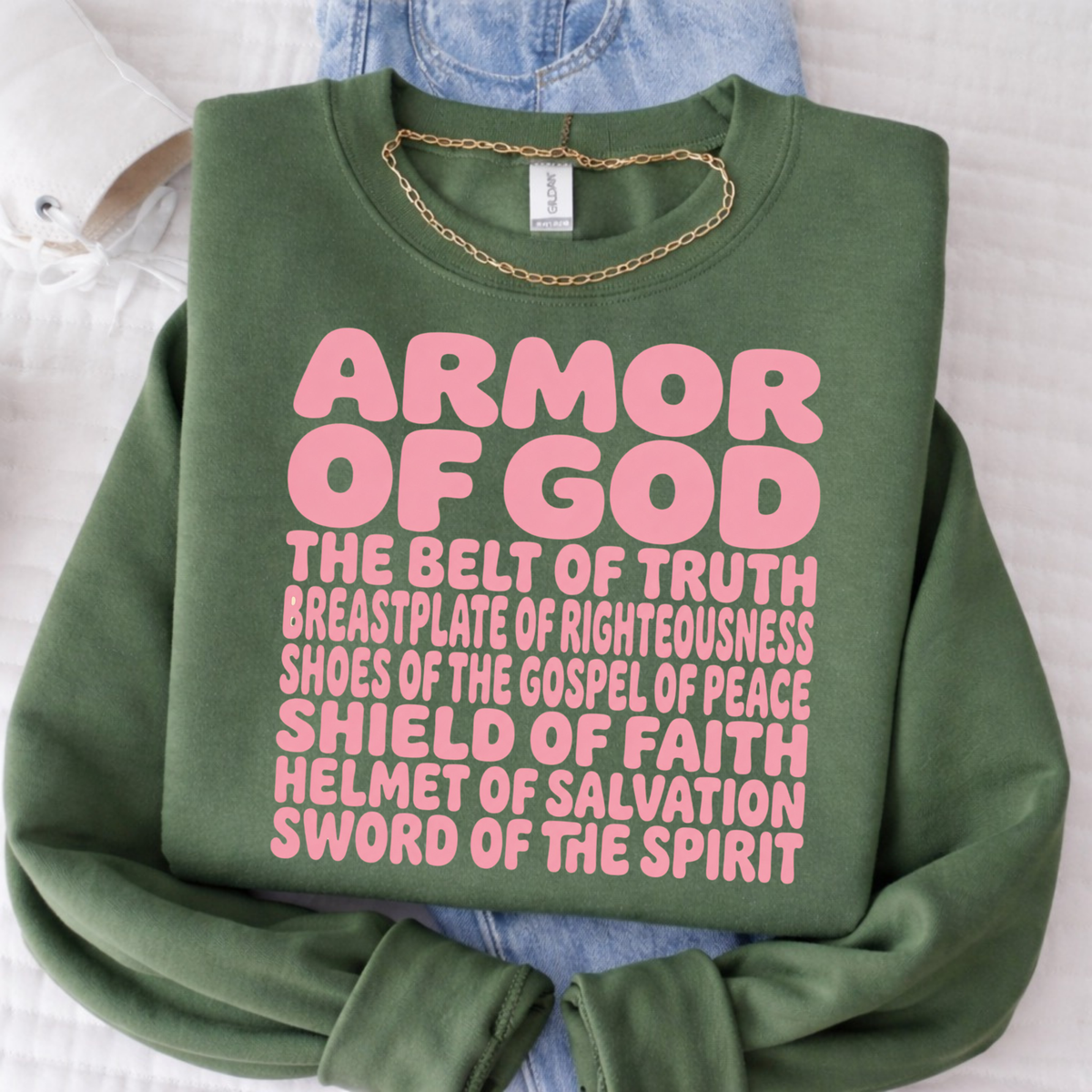 Green sweatshirt with pink 'Armor of God' text on a white background