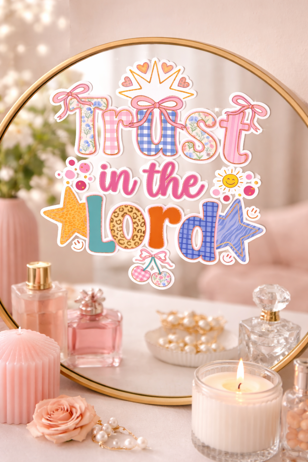 Decorative mirror with 'Trust in the Lord' sticker, candles, and perfume bottles on a table.