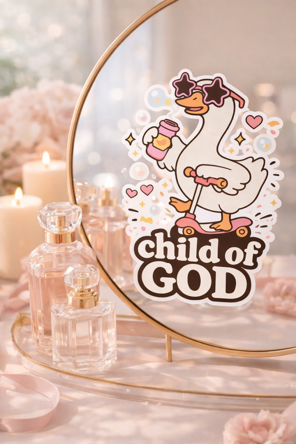 Decorative sign with a cartoon goose and 'Child of God' text on a mirror with candles and perfume bottles in the background.
