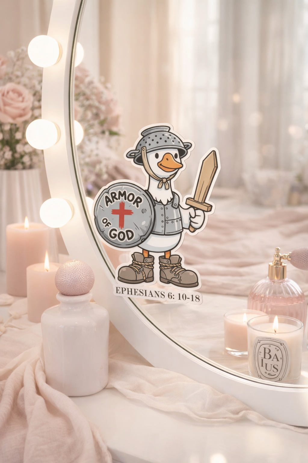 Decorative mirror with cartoon goose holding a sword and 'Armor of God' sign, surrounded by candles and bottles.