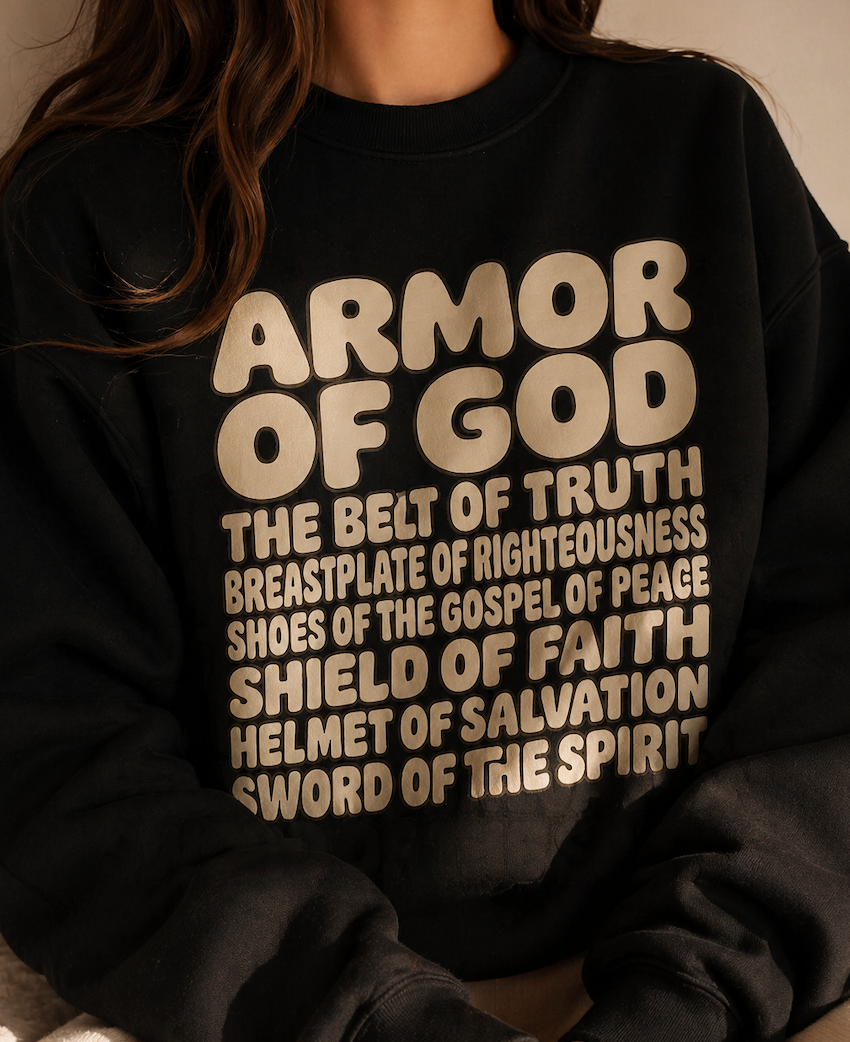 Black sweatshirt with 'Armor of God' text in beige on a neutral background
