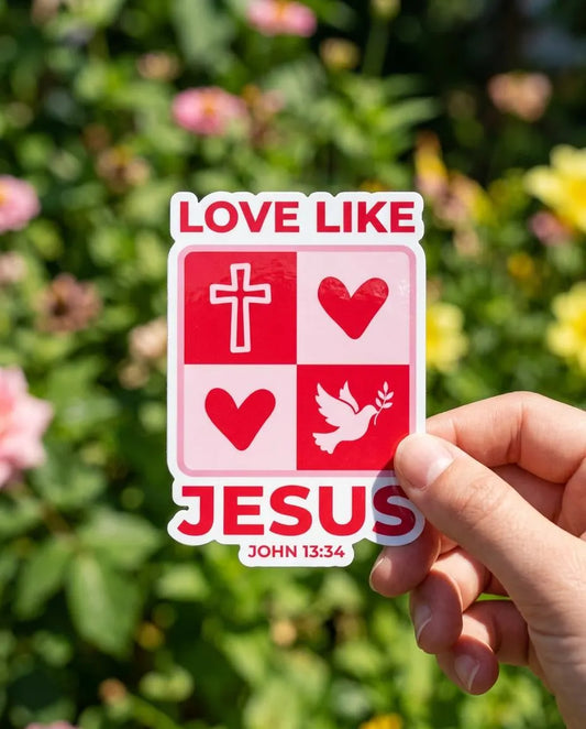 Christian Sticker "Love like Jesus" "John 13:34"held by a hand against a floral background